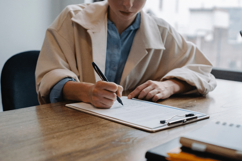 Woman writing on a pad